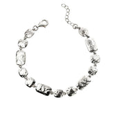 Silver necklace with clear beads on a white background